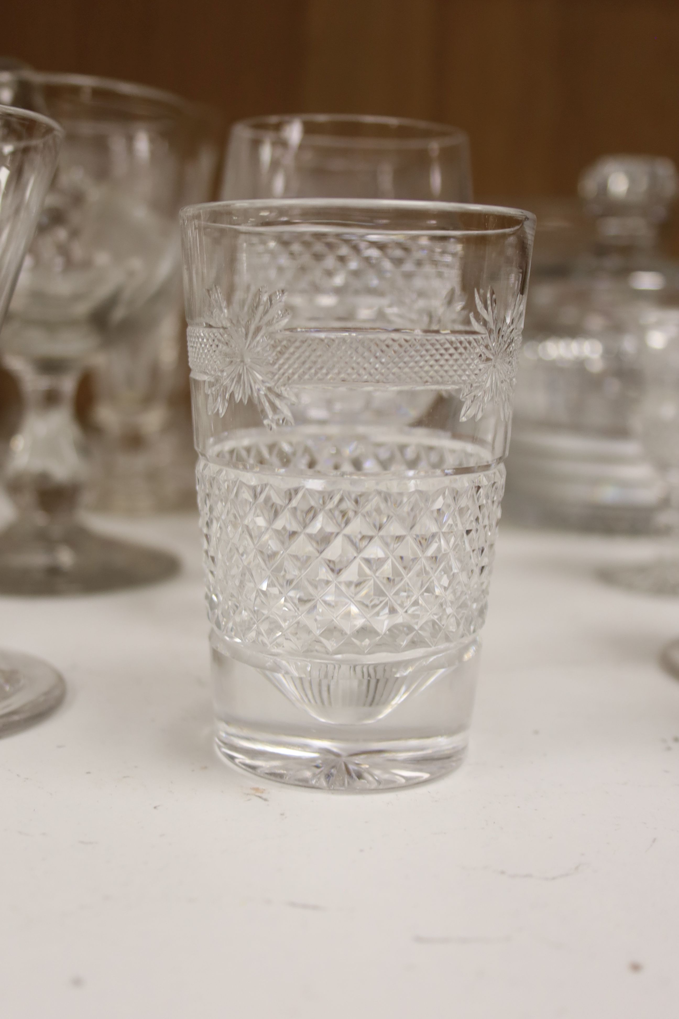 A collection of assorted mixed cut and etched glassware